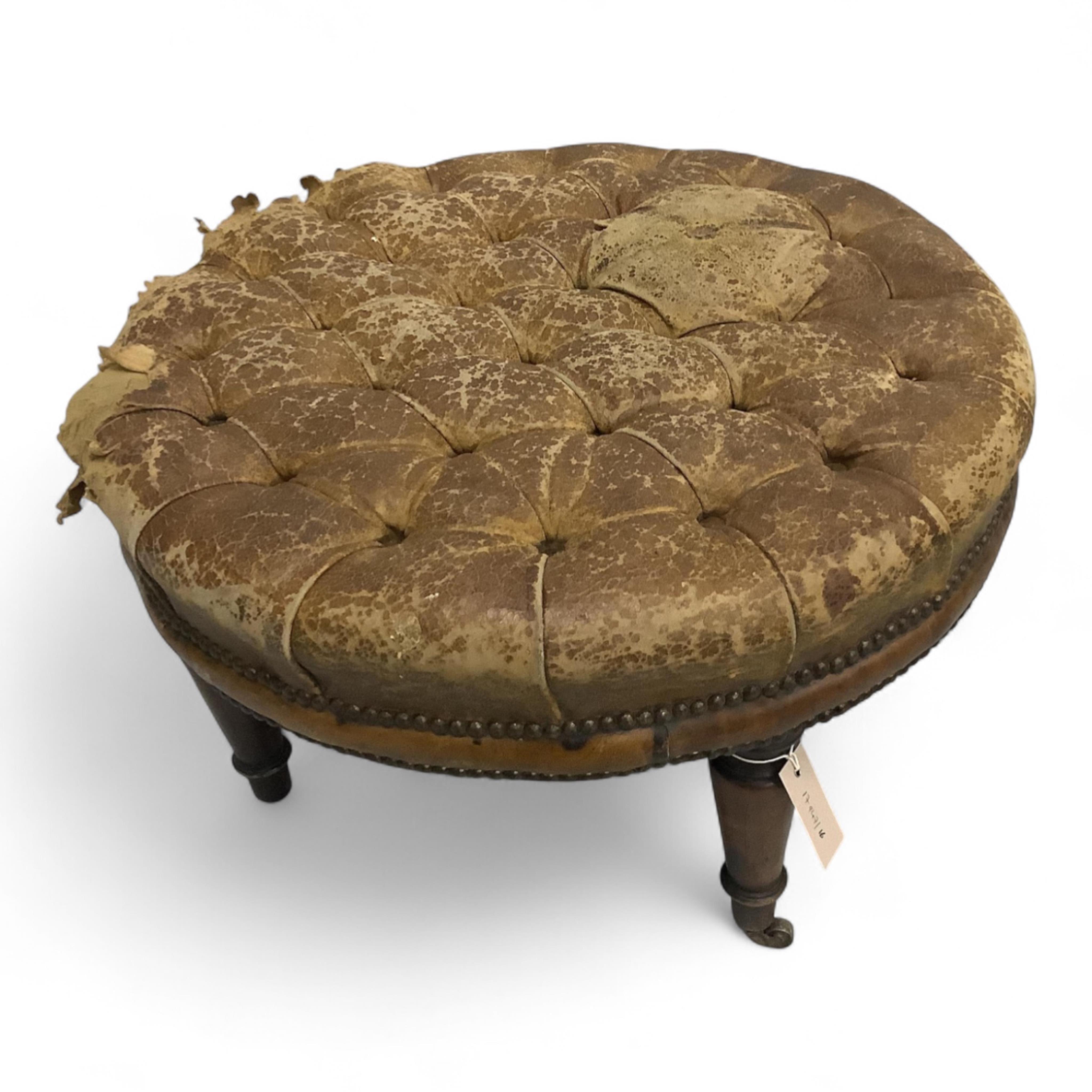 A Victorian style circular buttoned leather stool, diameter 62cm, height 32cm, missing two castors